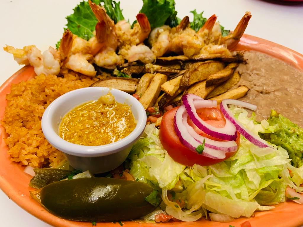 Camarones a la Mojo De Ajo · Jumbo shrimp cooked with butter and fresh garlic served with rice, beans, salad, french fries and guacamole.