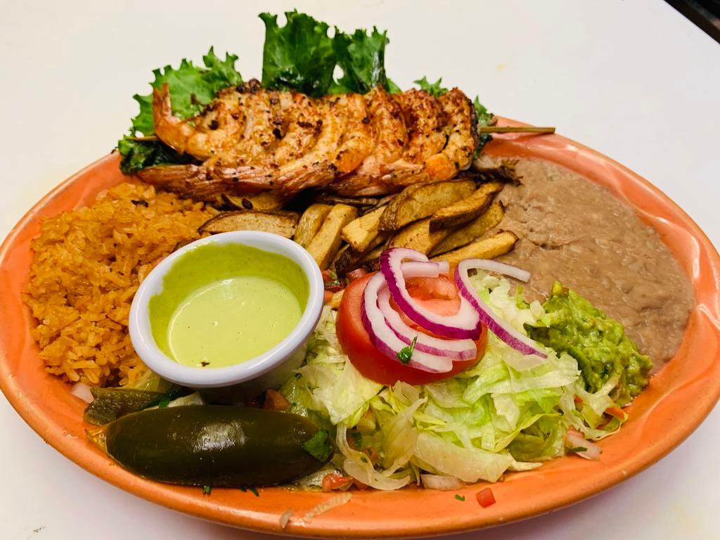 Camarones a la Plancha · Grilled jumbo shrimp served with rice, beans, salad, french fries and guacamole.