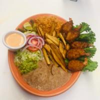 Camarones Empanizados · Breaded jumbo shrimp served with rice, beans, salad, french fries and guacamole.