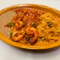 Camarones a la Diabla · Jumbo shrimp in a special spicy sauce served with rice and beans.