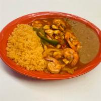 Camarones Rancheros con Pulpo · Jumbo shrimp with octopus in a red sauce served with rice and beans.