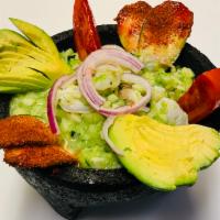 Camaron Aguachile · Served with tomato, onion, cilantro, avocado and cucumber.