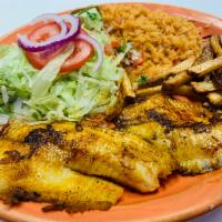 Filete de Tilapia Plate · Tilapia fillet served with rice, salad and french fries.