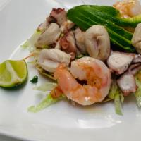 Tostada Mixta · Tostada with diced tomatoes, onion, cucumber, lime with shrimp, octopus and abalone.