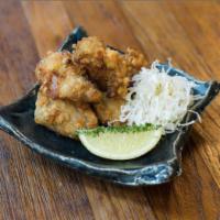 Chicken Karaage · Japanese style boneless crispy chicken (8pc), field of iceberg lettuce, daikon radish sweet ...