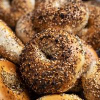 Hand Rolled Bagels with Butter · our sourdough bagels are hand rolled, naturally leavened and kettle boiled each morning