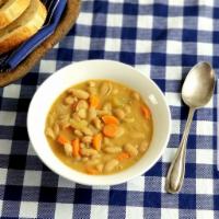 Fasolada (White Bean Soup) · Delicious White Bean Soup. Considered a national dish of Greece! Rich white bean soup with v...