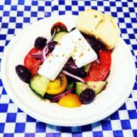 Horiatiki (Village Salad) · Greek village salad. Traditional Greek salad - fresh tomatoes, cucumbers, bell peppers, onio...