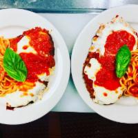 Chicken Parm and Pasta · Crispy chicken cutlet topped with tomato sauce and fresh mozzarella served with rigatoni