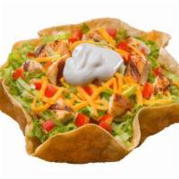 Grilled Chicken Taco Salad · Crispy tortilla bowl filled with sliced grilled chicken breast, shredded cheddar cheese, cri...