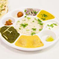 Punjabi Vegetable Thali · Served with two vegetable curries, one tadka bal,  one naan, rice, one sweet, pickle, raita ...