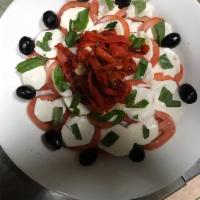 Roasted Peppers and Tomato Salad · Served with fresh mozzarella.