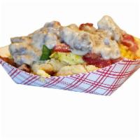 Ivana Biscuit · 2 large biscuits with 3 scrambled eggs smothered in our sausage gravy
