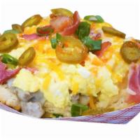 Phil D. Biscuit - Bring the Heat · 2  large biscuits served with 3 eggs smothered in our sausage gravy, bacon, jalapenos lightl...
