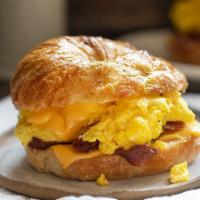 Croissant Sandwich Breakfast · Large crescent served with egg, cheese and your choice of bacon or sausage.