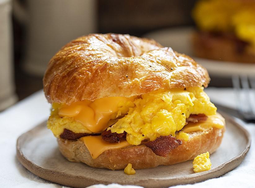 Croissant Sandwich Breakfast · Large crescent served with egg, cheese and your choice of bacon or sausage.