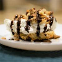 Warm Reese's Peanut Butter Biscuit · Melty Reese’s peanut butter cup biscuit served with our freshly made whipped drizzled with c...