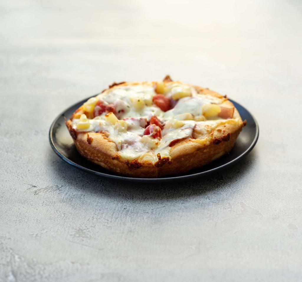 The Hawaiian Pizza · Just the right touch of tender sweet pineapple chunks are in this classic. Our special sauce, mozzarella cheese, lean Canadian style bacon.