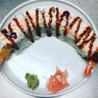 Tornado Roll · 8 pieces. Shrimp tempura and cream cheese inside, crab meat and eel sauce on top.