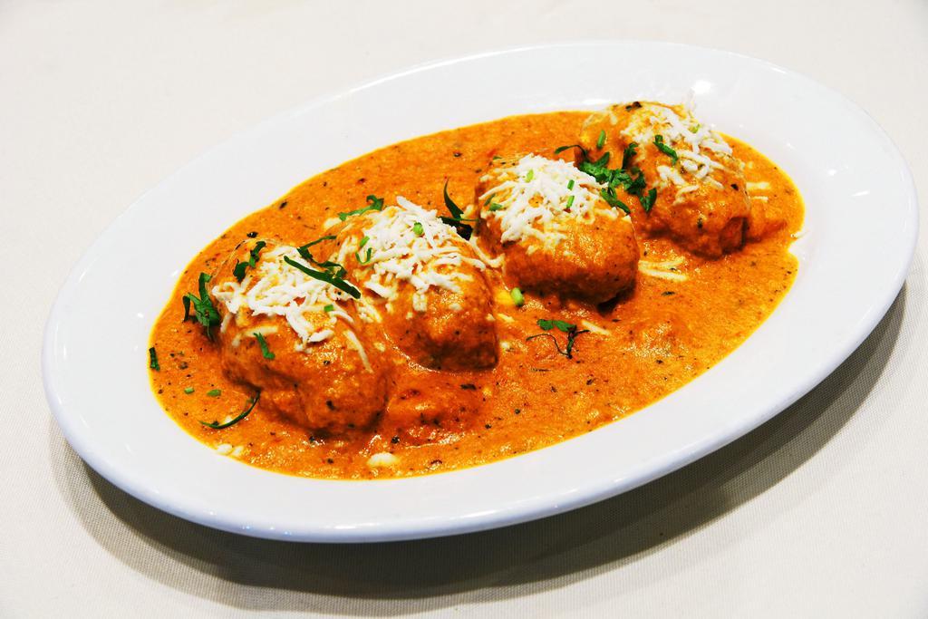 Malai Kofta · Soft and creamy homemade cottage cheese dumpling stuffed with dry fruits, cooked in a mild sauce.