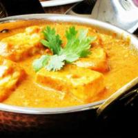 Mango Curry · Paneer cooked in a mango curry sauce with spices.