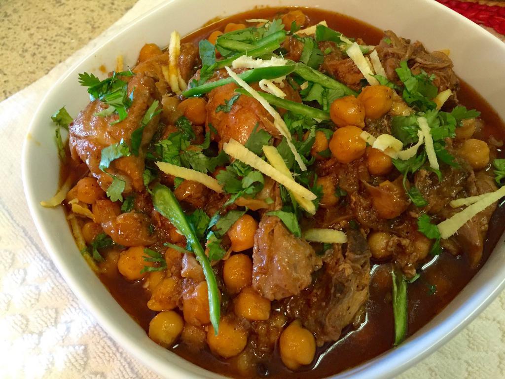 Chole · Chickpeas cooked with Your Choice of protein in a mild, thick sauce.