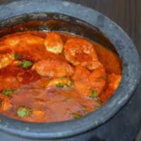 Hyderabadi Fish Curry · A spicy curry cooked with onions and spices.