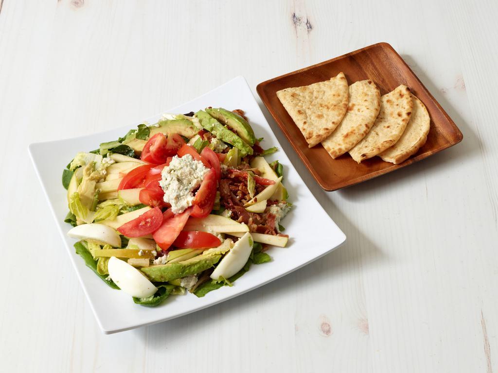 Cobb Salad · Mixed field greens, avocado, bacon, tomato, boiled egg, blue cheese, green apple.