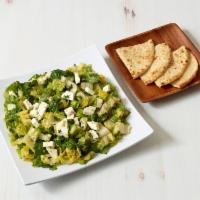 Marouli Salad · Baby romaine with scallions, dill and feta in olive oil with lemon vinaigrette.