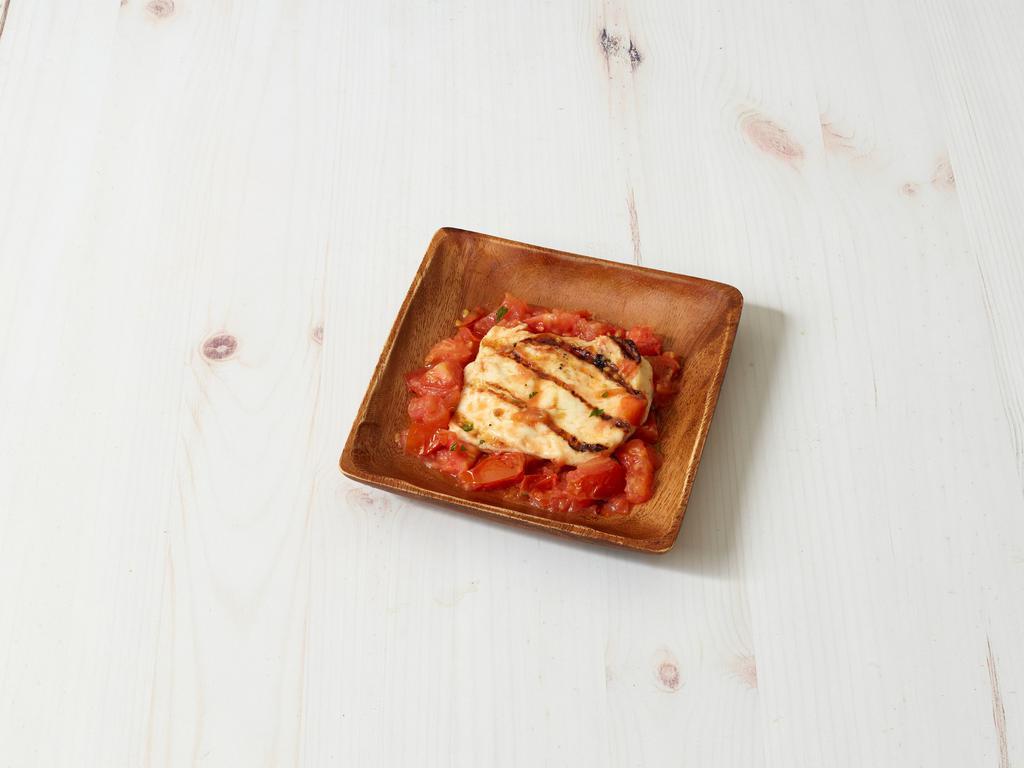 Halloumi · Grilled Cypriot cheese topped with tomatoes and olive oil.