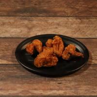 Fried Chicken Wings · Four pieces.