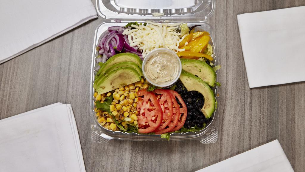 Santa Fe Salad · Included mixed salad, red onions, yellow peppers, roasted corn, black beans, avocado, tomatoes, mozzarella, spicy cilantro ranch dressing.
