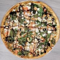 The Mediterranean Pizza · Included: roasted chicken, spinach, tomatoes, onions, olives, mixed cheese, pesto sauce, bas...