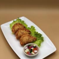 Karipap (Curry Puffs - 3 Per Order) · A classic Thai snack; golden fried pastries packed
with curried potato and chicken