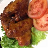 Thai Spicy Wings · Fried marinated chicken wing mix with special Thai style Sriracha spicy Sauce