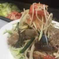Som Tum Pu Plara (Lao Papaya Salad) · The very essence of Isan: shredded green papaya, pla ra (fermented anchovy paste), pu dong (...