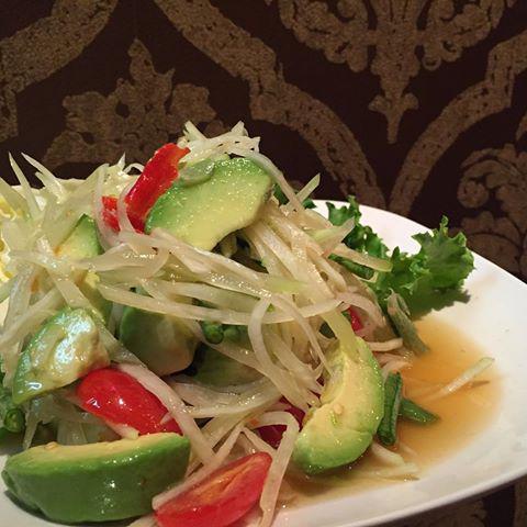 Som Tum Avocado (Avocado Papaya Salad) · Shredded green papaya w/ avocado, palm sugar, fish sauce, lime, chilies, garlic, long bean, and tomato