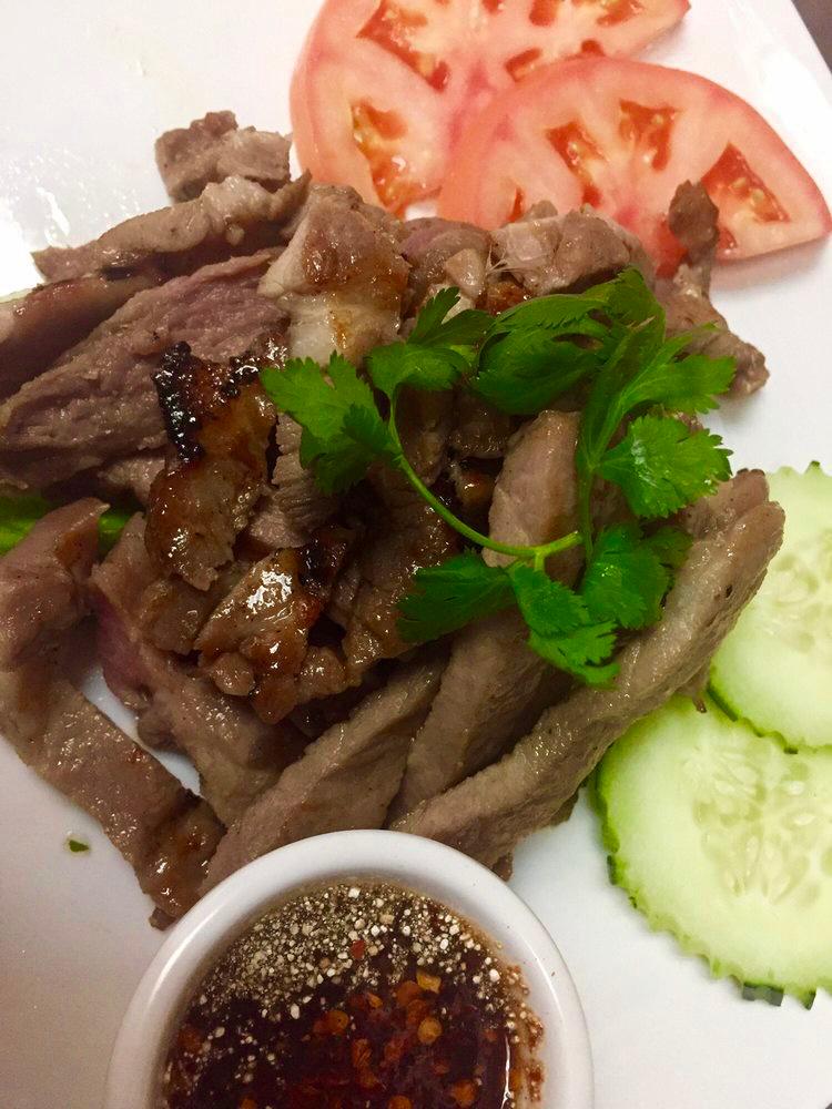 Moo Yang (Pork) · Grilled marinated pork served w/ spicy jaew dipping sauce