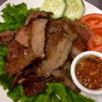 Nuer Yang (Beef) · Grilled marinated beef served w/ spicy jaew dipping sauce