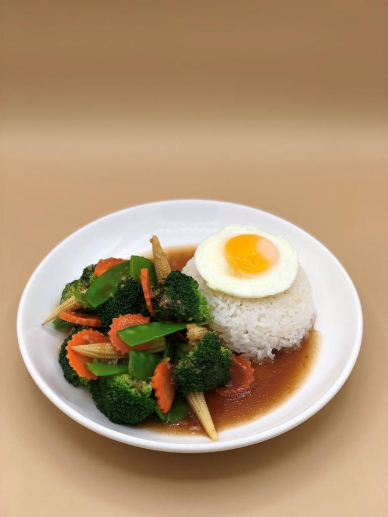 Pad Pakruam  (Mixed Vegetables Stir-fry Over Rice) · Stir fried mixed vegetables w/ garlic sauce. Served w/poached egg