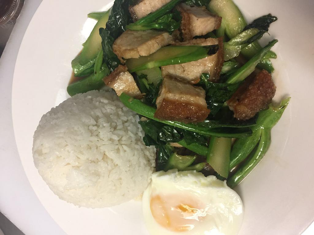 Pad Kana  (Chinese Broccoli Stir-Fry Over Rice) · Stir fried Chinese broccoli w/ garlic sauce, served w/ poached egg and rice
