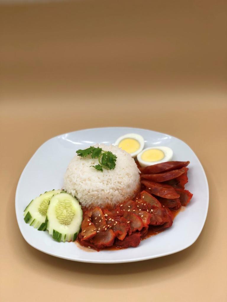 Kow Moo Dang (Roasted Pork Over Rice) · Roasted five-spice marinated pork, Chinese sweet sausage. Served w/ sesame gravy, boiled egg, and rice