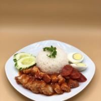Kow Moo Grob (Crispy Pork Belly Over Rice) · Fried pork belly and Chinese sweet sausage. Served w/ sesame gravy, boiled egg, and rice