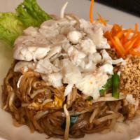 Pad Thai Pu · Thin rice noodles stir fried w/ bean sprouts, chives, egg, tamarind, and preserved radish, a...