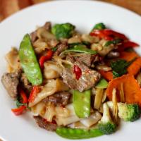 Pad Kee Mao (Drunken Noodle) · Broad noodles, mixed vegetables, wild ginger, pickled peppercorns, sautéed with spicy basil ...