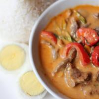 Gaeng Panang · Panang curry w/ bell pepper, basil, lime leaf, coconut milk, and choice of meat. Served w/ r...