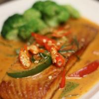 Salmon Panang  · Pan fried salmon with Panang curry and steamed vegetables.