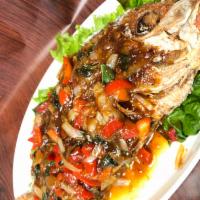 Pla Rard Prig · Crispy whole red snapper with tamarind based sauce with chili, garlic, bell pepper, basil, s...