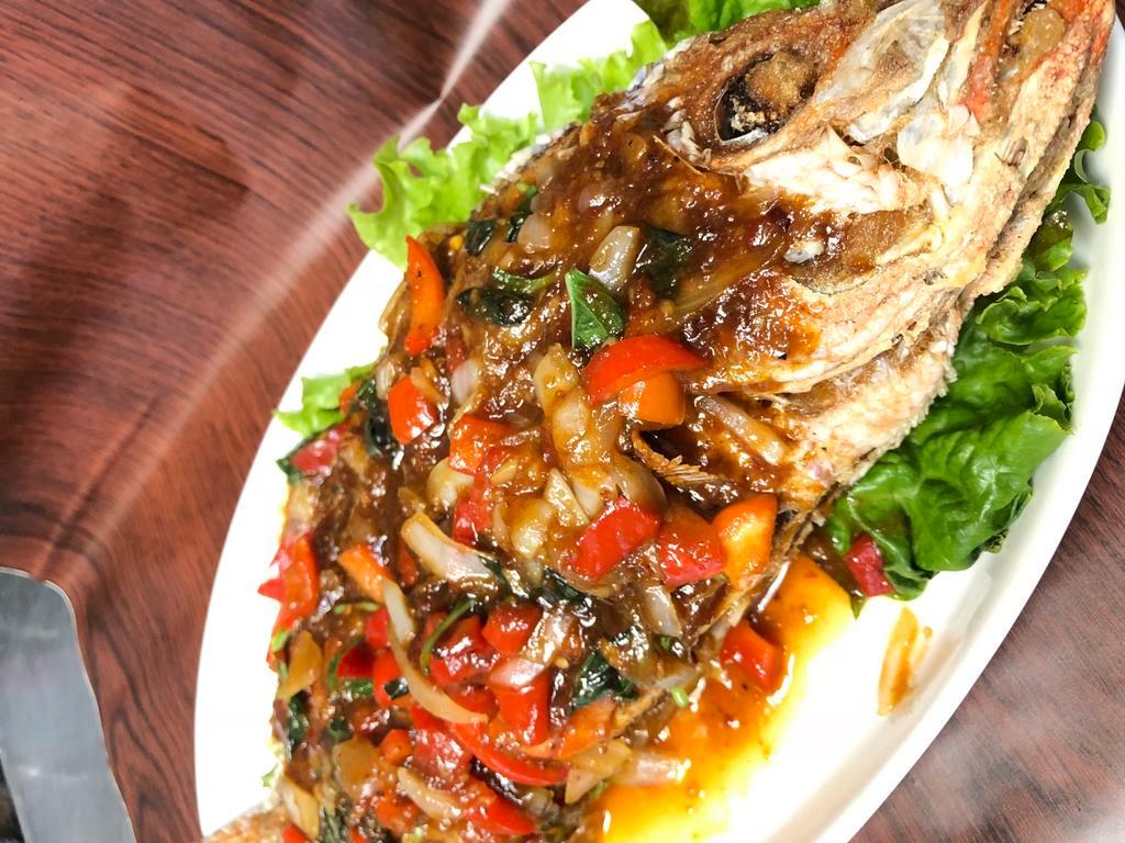 Pla Rard Prig · Crispy whole red snapper with tamarind based sauce with chili, garlic, bell pepper, basil, served w/rice
