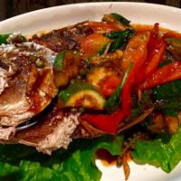Pla Pad Ped · Crispy whole Red snapper sauteed with Thai eggplant, pickled peppercorns, bell pepper,
basil...